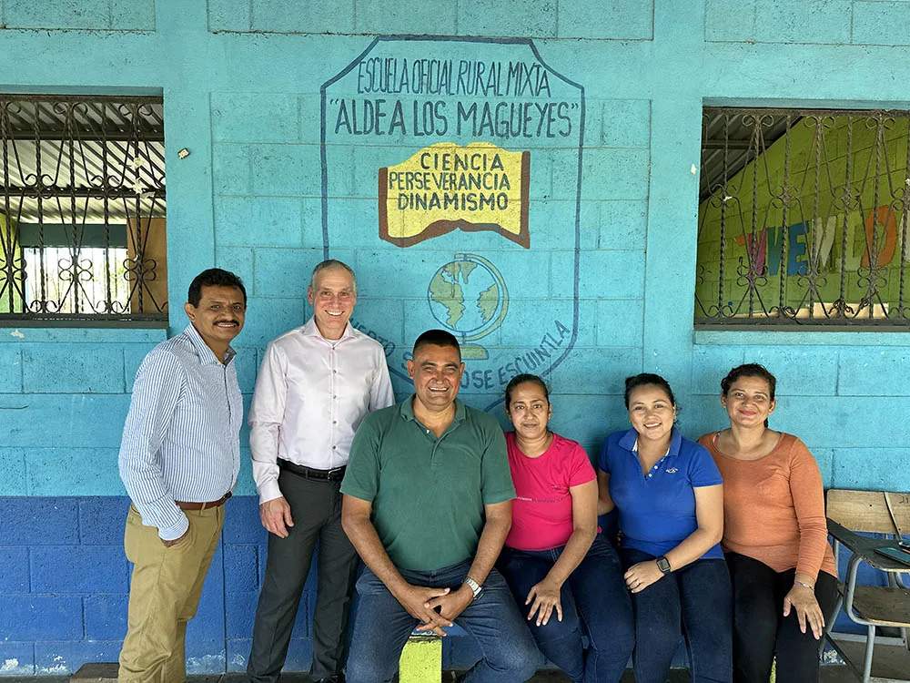 international-5 Crossroads leaders gather outside a school during an international visit.