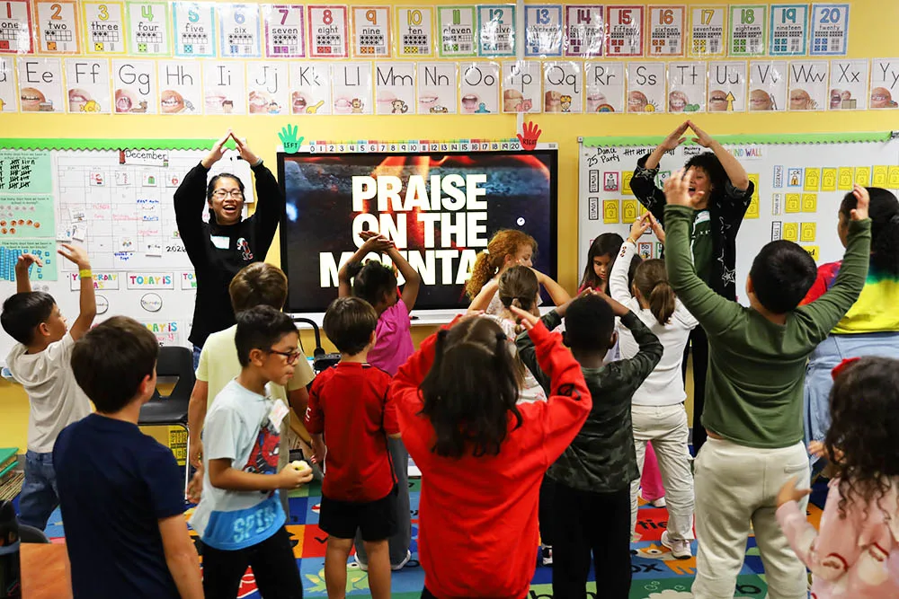 mission-evangelism A leader sharing the gospel with children